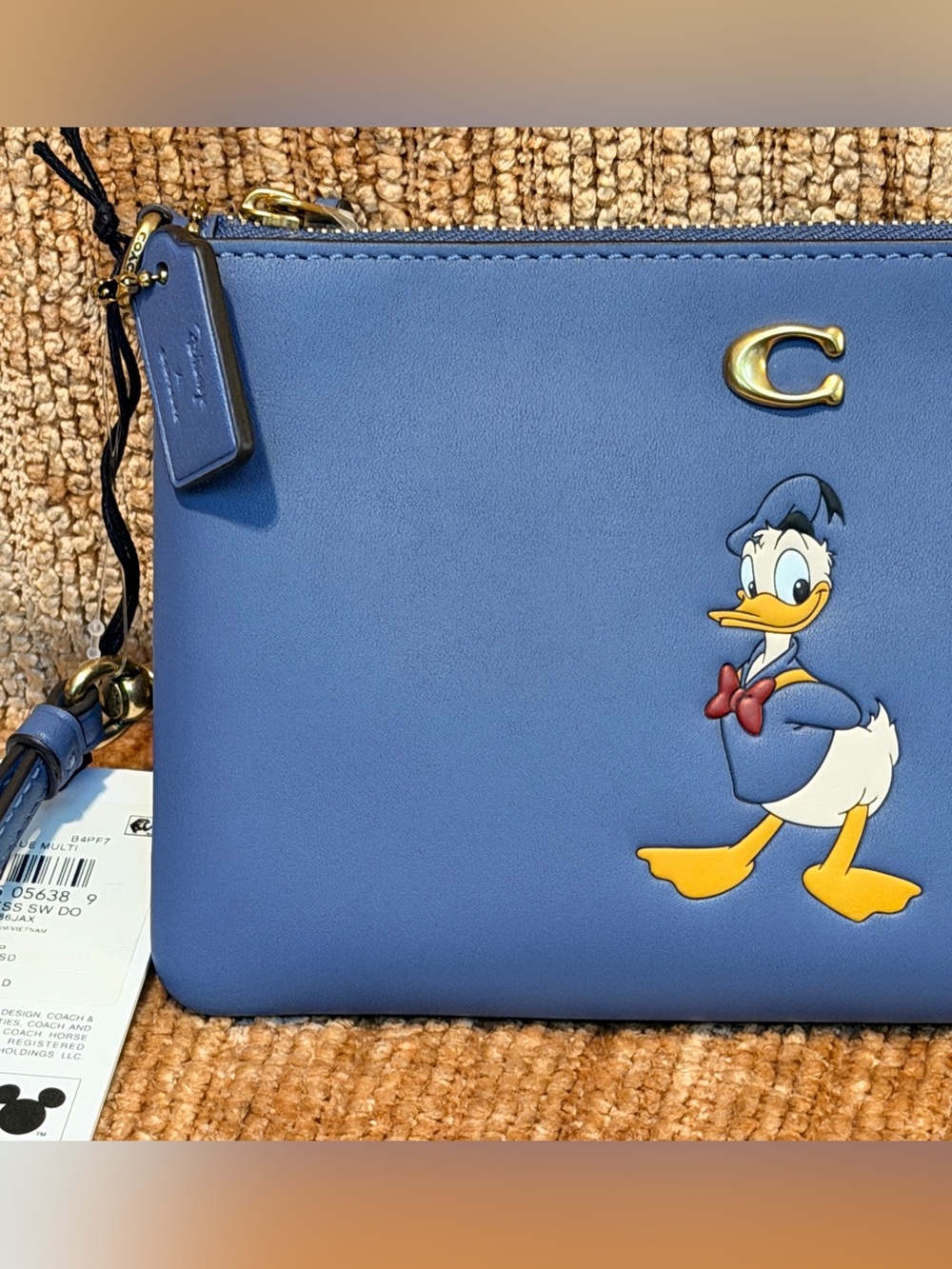 Disney X Coach Essential Small Wristlet With Donald Duck	#CDM64. NWTs